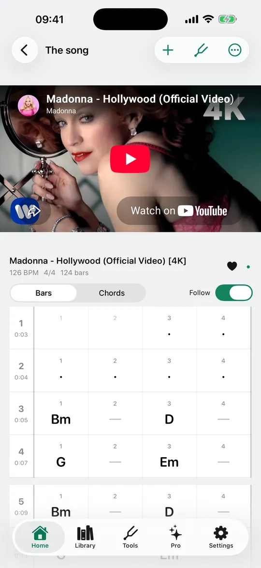 The chord grid scrolling bar by bar in time with the YouTube video, with the current bar lit